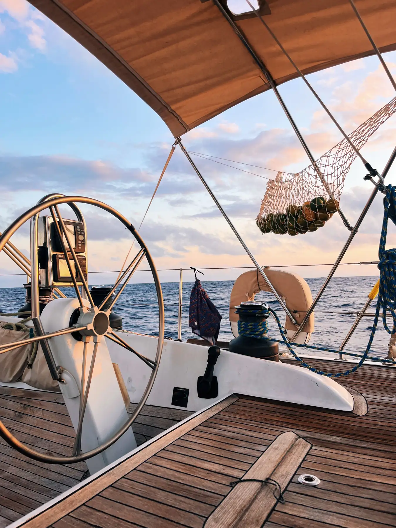 The sailboat's helm at sunset