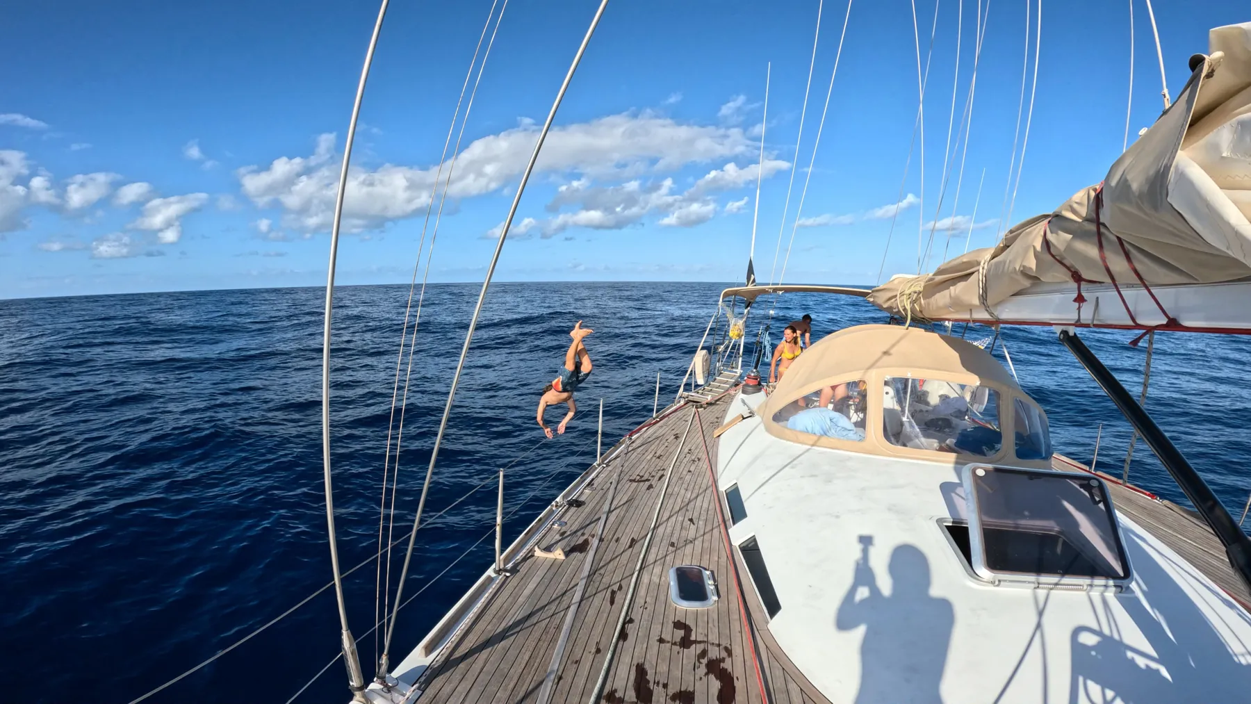 Sailboat under sail, seen from the deck
